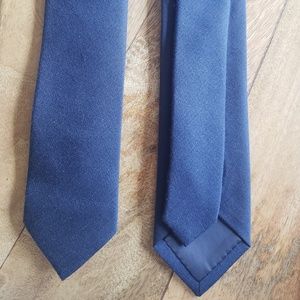 One navy blue wool tie
